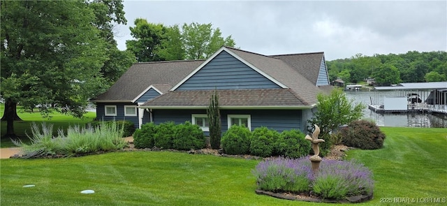 30141 Gentle Cv, Gravois Mills, MO 65037 - view of front of house with a front lawn, a dock, a shingled roof, and boat lift