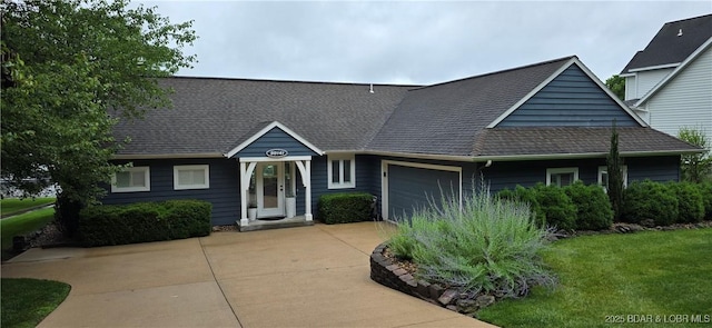 30141 Gentle Cv, Gravois Mills, MO 65037 - view of front of house featuring an attached garage, concrete driveway, a front lawn, and a shingled roof