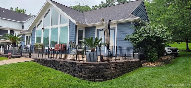 30141 Gentle Cv, Gravois Mills, MO 65037 - back of house with a patio area and roof with shingles