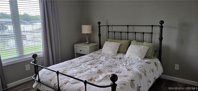 30141 Gentle Cv, Gravois Mills, MO 65037 - bedroom with baseboards and dark wood finished floors