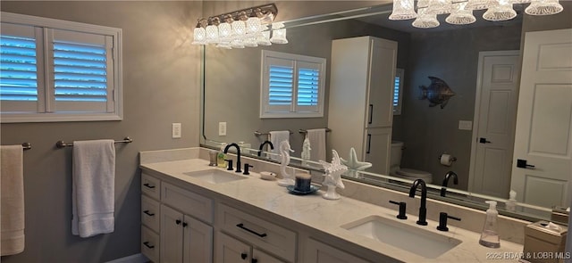 30141 Gentle Cv, Gravois Mills, MO 65037 - bathroom featuring a chandelier and double vanity