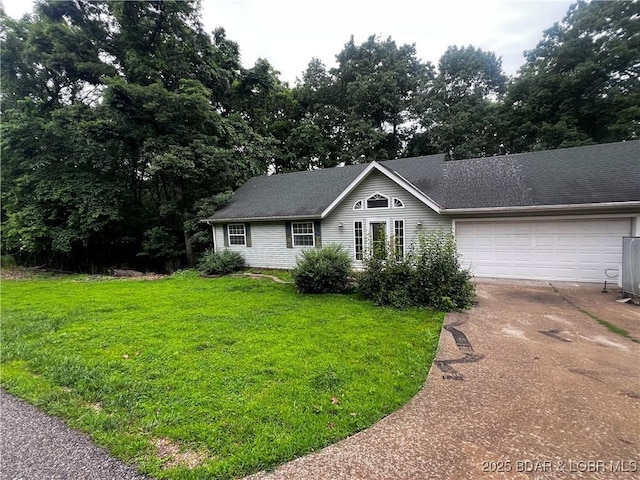 1509 Oak Bend Rd, Sunrise Beach, MO 65079 - single story home featuring driveway, a garage, a front yard, and roof with shingles