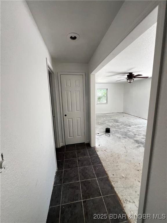 1509 Oak Bend Rd, Sunrise Beach, MO 65079 - corridor featuring dark tile patterned floors
