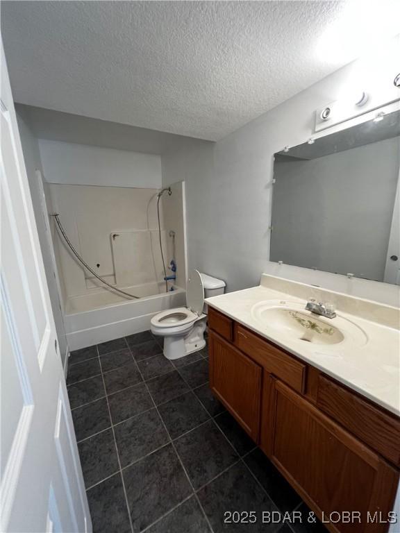 1509 Oak Bend Rd, Sunrise Beach, MO 65079 - bathroom with vanity, shower / bathtub combination, a textured ceiling, and tile patterned floors