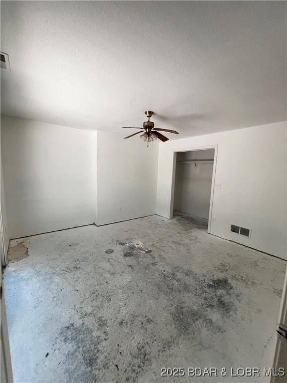 1509 Oak Bend Rd, Sunrise Beach, MO 65079 - unfurnished bedroom featuring unfinished concrete floors and ceiling fan