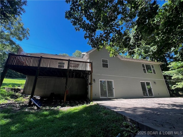 1509 Oak Bend Rd, Sunrise Beach, MO 65079 - rear view of house featuring a wooden deck