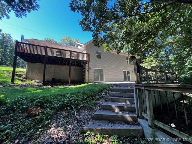 1509 Oak Bend Rd, Sunrise Beach, MO 65079 - back of house with a wooden deck and stairs