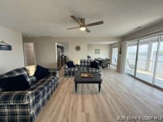 320 Regatta Bay Cir Unit 3B, Lake Ozark, MO 65049 - living area with ceiling fan and light wood-style floors