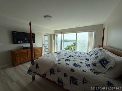 320 Regatta Bay Cir Unit 3B, Lake Ozark, MO 65049 - bedroom with wood finished floors