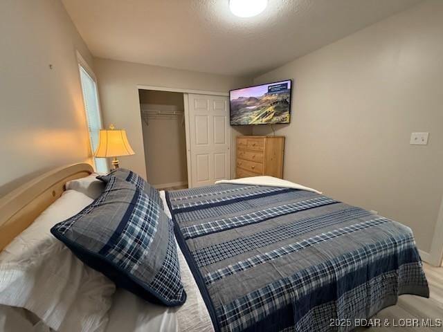 320 Regatta Bay Cir Unit 3B, Lake Ozark, MO 65049 - bedroom featuring a closet and baseboards