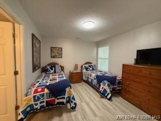 320 Regatta Bay Cir Unit 3B, Lake Ozark, MO 65049 - bedroom with wood finished floors