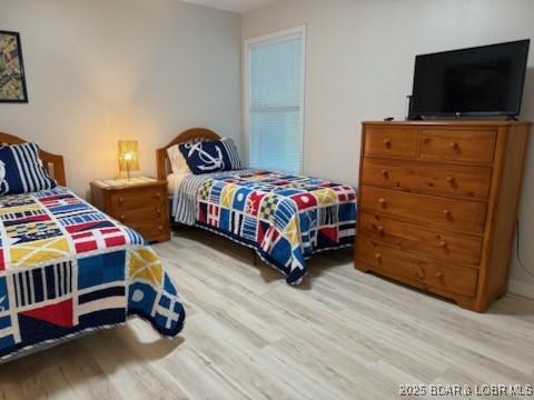 320 Regatta Bay Cir Unit 3B, Lake Ozark, MO 65049 - bedroom with wood finished floors
