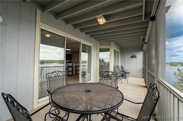 320 Regatta Bay Cir Unit 3B, Lake Ozark, MO 65049 - balcony featuring a water view and outdoor dining area