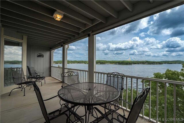 320 Regatta Bay Cir Unit 3B, Lake Ozark, MO 65049 - balcony with a water view and outdoor dining space