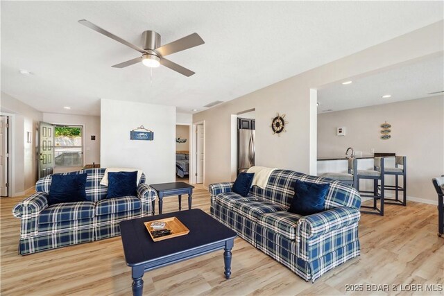 320 Regatta Bay Cir Unit 3B, Lake Ozark, MO 65049 - living room with light wood-type flooring, ceiling fan, and recessed lighting
