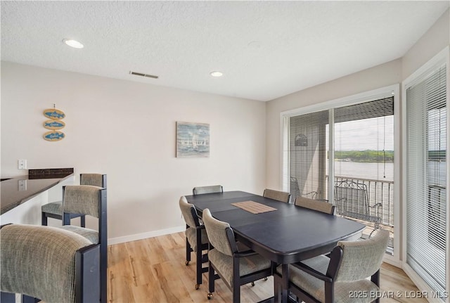 320 Regatta Bay Cir Unit 3B, Lake Ozark, MO 65049 - dining room featuring light wood-type flooring and recessed lighting