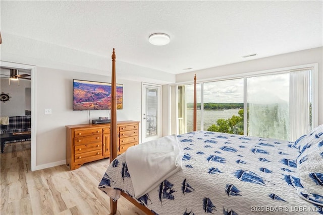 320 Regatta Bay Cir Unit 3B, Lake Ozark, MO 65049 - bedroom featuring access to outside and light wood-style flooring