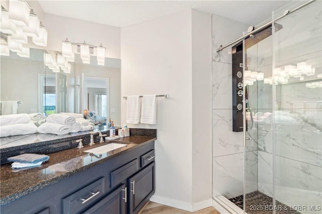 320 Regatta Bay Cir Unit 3B, Lake Ozark, MO 65049 - bathroom featuring a marble finish shower and vanity