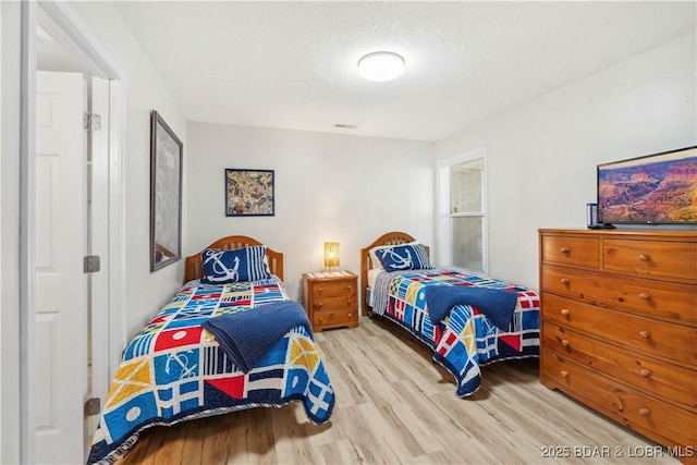 320 Regatta Bay Cir Unit 3B, Lake Ozark, MO 65049 - bedroom with wood finished floors