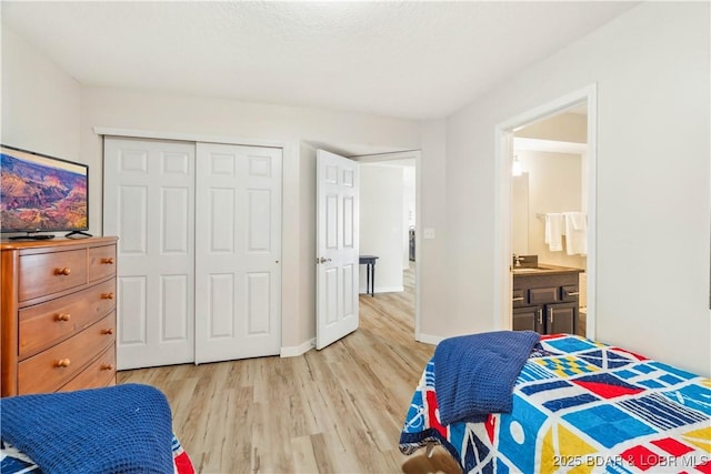 320 Regatta Bay Cir Unit 3B, Lake Ozark, MO 65049 - bedroom with light wood-style flooring and a closet
