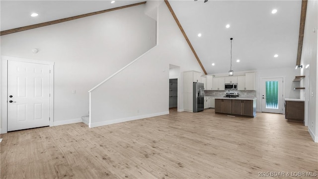 1778 Country Club Dr, Lake Ozark, MO 65049 - unfurnished living room with beam ceiling, stairs, high vaulted ceiling, light wood-style floors, and recessed lighting