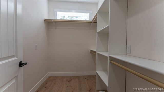 1778 Country Club Dr, Lake Ozark, MO 65049 - walk in closet with light wood finished floors
