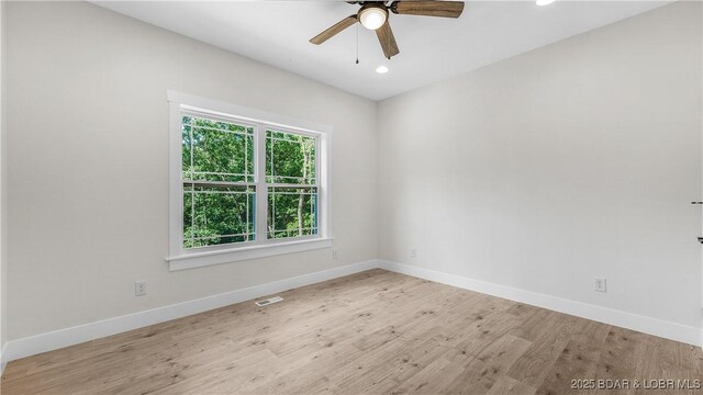 1778 Country Club Dr, Lake Ozark, MO 65049 - unfurnished room with wood finished floors, a ceiling fan, and recessed lighting