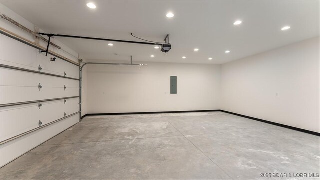 1778 Country Club Dr, Lake Ozark, MO 65049 - garage featuring recessed lighting, electric panel, and a garage door opener
