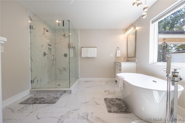 5885 Baydy Peak Rd, Osage Beach, MO 65065 - bathroom with a freestanding bath, vanity, a marble finish shower, and marble finish flooring