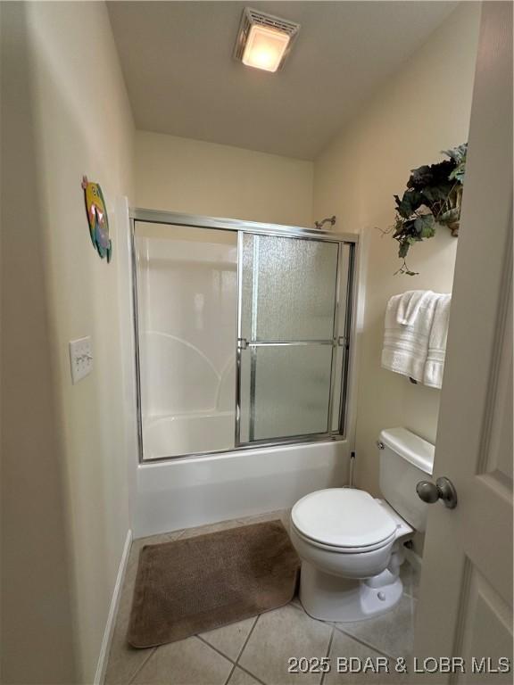 18134 Millstone Cove Rd Unit 212, Gravois Mills, MO 65037 - full bathroom featuring tile patterned floors and bath / shower combo with glass door