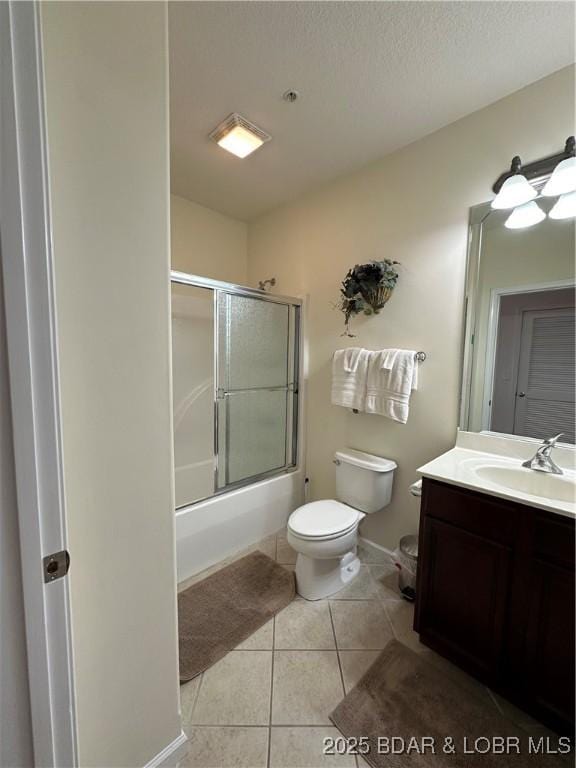 18134 Millstone Cove Rd Unit 212, Gravois Mills, MO 65037 - full bath featuring vanity, bath / shower combo with glass door, and tile patterned floors