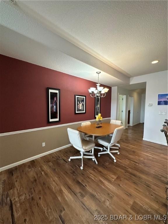 18134 Millstone Cove Rd Unit 212, Gravois Mills, MO 65037 - dining room with wood finished floors, a textured ceiling, and a chandelier