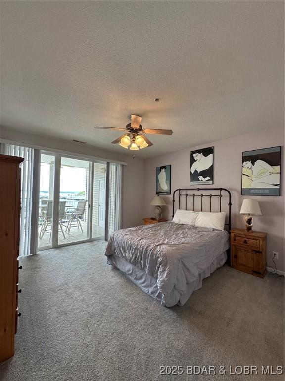 18134 Millstone Cove Rd Unit 212, Gravois Mills, MO 65037 - bedroom with access to exterior, carpet floors, and ceiling fan