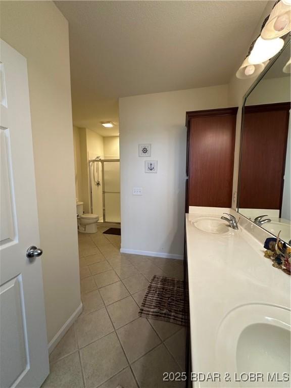 18134 Millstone Cove Rd Unit 212, Gravois Mills, MO 65037 - full bath with tile patterned flooring, double vanity, and a stall shower