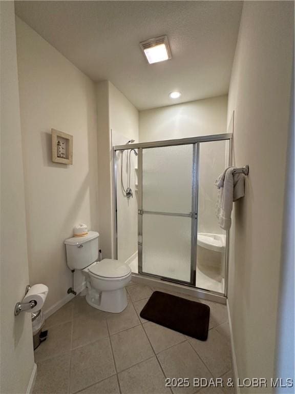 18134 Millstone Cove Rd Unit 212, Gravois Mills, MO 65037 - bathroom with a stall shower and tile patterned flooring