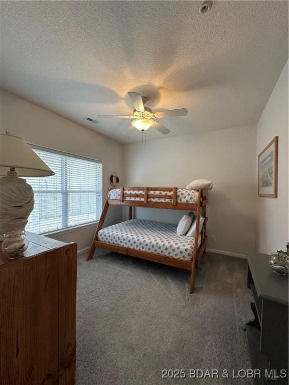 18134 Millstone Cove Rd Unit 212, Gravois Mills, MO 65037 - carpeted bedroom with a textured ceiling and a ceiling fan