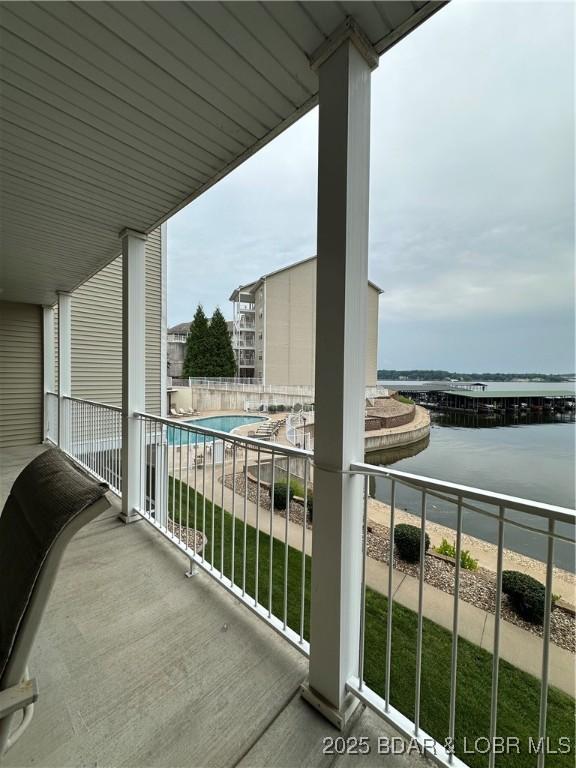 18134 Millstone Cove Rd Unit 212, Gravois Mills, MO 65037 - balcony with a water view and view of pool area