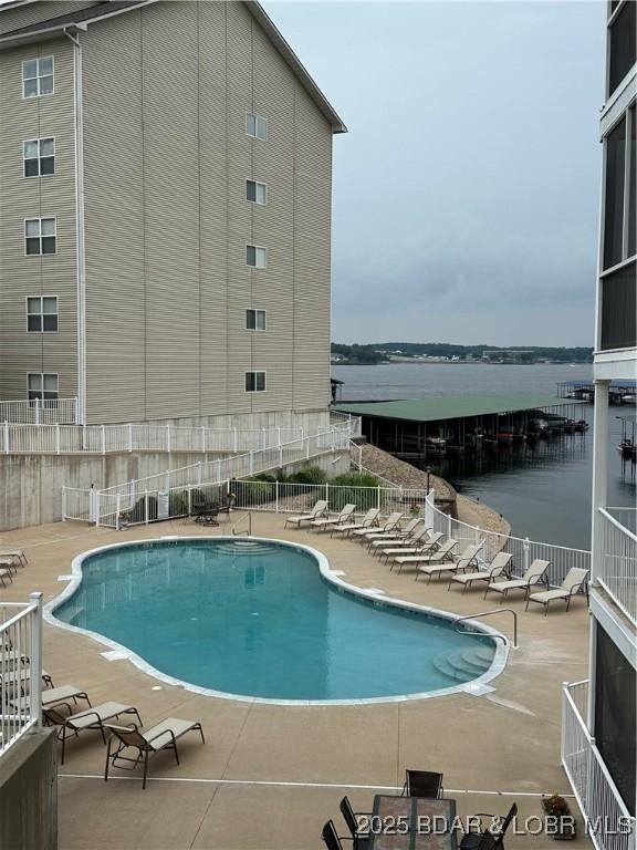 18134 Millstone Cove Rd Unit 212, Gravois Mills, MO 65037 - community pool featuring a patio and a water view
