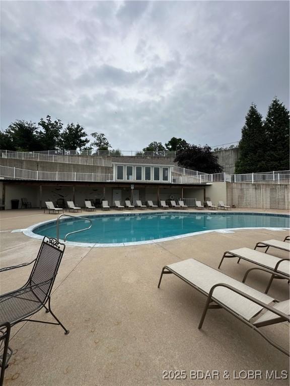 18134 Millstone Cove Rd Unit 212, Gravois Mills, MO 65037 - community pool featuring a patio