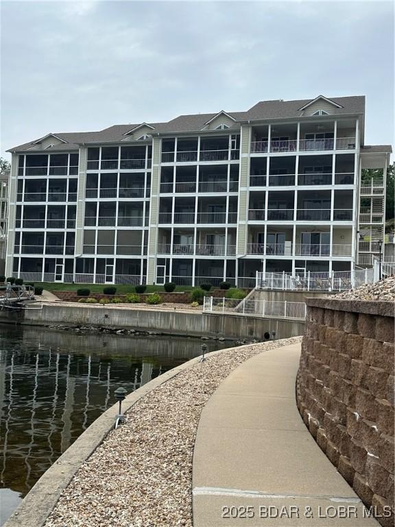 18134 Millstone Cove Rd Unit 212, Gravois Mills, MO 65037 - view of building exterior with a water view