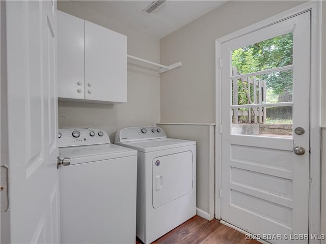 25 Primrose Ln, Camdenton, MO 65020 - washroom with cabinet space, washing machine and dryer, plenty of natural light, and dark wood-style floors