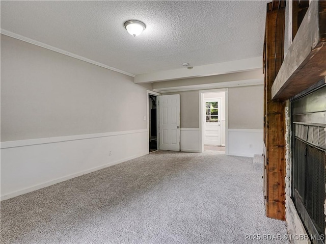 25 Primrose Ln, Camdenton, MO 65020 - unfurnished living room with a textured ceiling, carpet floors, and crown molding