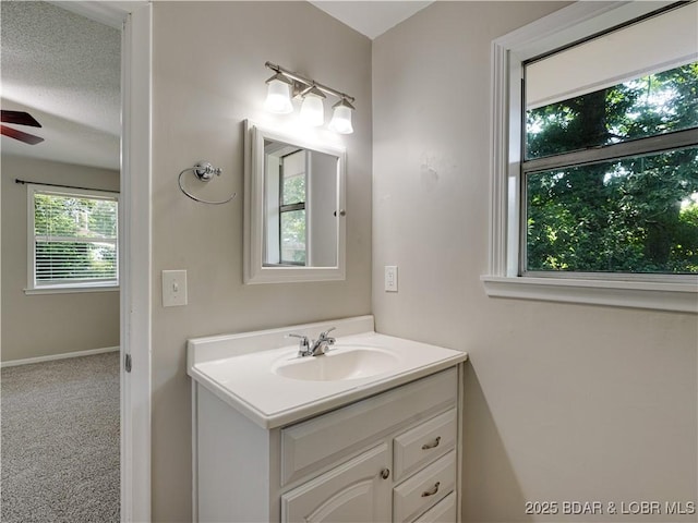 25 Primrose Ln, Camdenton, MO 65020 - bathroom with vanity, a ceiling fan, and a textured ceiling