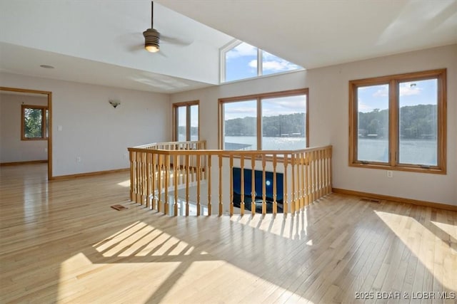 29773 Hemlock Rd, Gravois Mills, MO 65037 - corridor with wood finished floors, a water view, and an upstairs landing