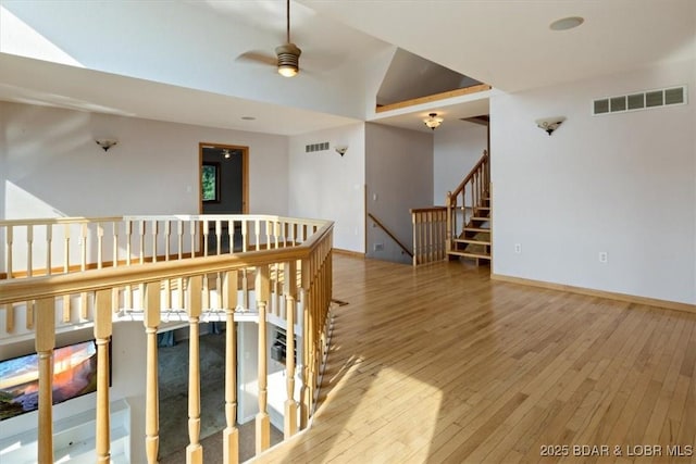 29773 Hemlock Rd, Gravois Mills, MO 65037 - hallway with hardwood / wood-style floors and an upstairs landing