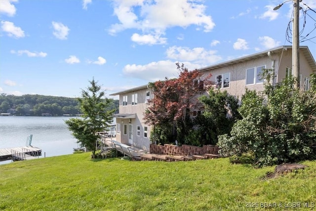 29773 Hemlock Rd, Gravois Mills, MO 65037 - view of grassy yard with a boat dock and a water view