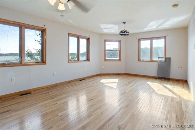 29773 Hemlock Rd, Gravois Mills, MO 65037 - spare room with light wood finished floors and a ceiling fan