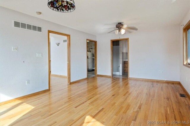 29773 Hemlock Rd, Gravois Mills, MO 65037 - spare room featuring light wood-type flooring, ceiling fan, and a smoke detector