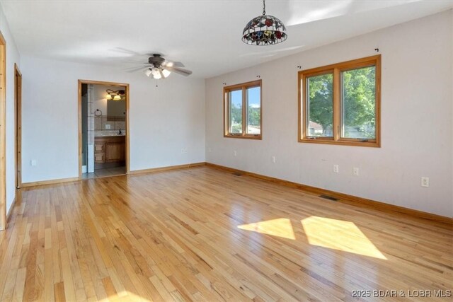 29773 Hemlock Rd, Gravois Mills, MO 65037 - unfurnished room with light wood-style floors and ceiling fan