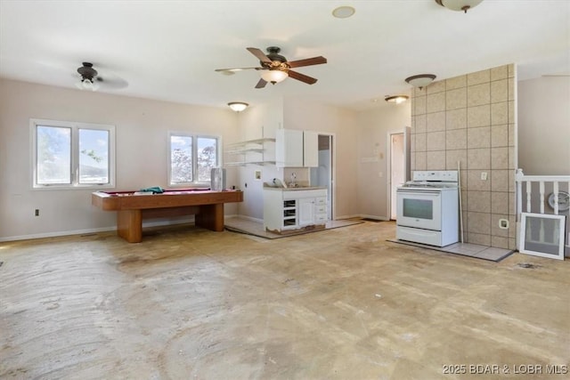29773 Hemlock Rd, Gravois Mills, MO 65037 - kitchen featuring white electric range oven, a ceiling fan, concrete floors, and pool table